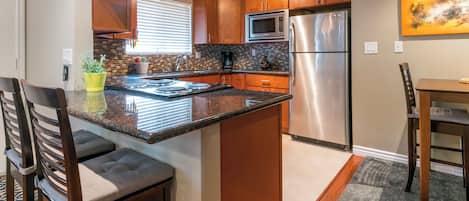 Coffee/tea maker, fridge, microwave, oven