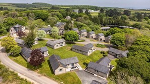 A residential area with houses, roads, and greenery. - 2 Bed in Saltash (oc-87705) (Saint Mellion)