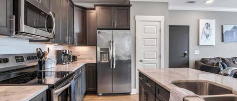 Coffee/tea maker, fridge, microwave, oven