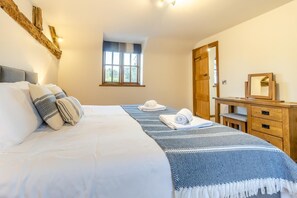 A bedroom with a bed, a window, a dresser, and a mirror. - 4 Bed in Oswestry (oc-88850) (Morda)