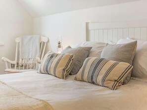 A bedroom with a bed, pillows, a chair, and a bedside table. - 3 Bed in Blyth (oc-87734) (Blyth)