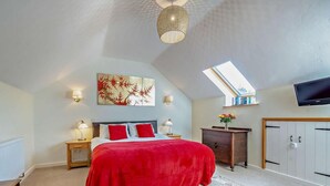 A bedroom with a bed, bedside lamps, a desk, a television, and a skylight. - 2 Bed in Aldham (oc-87956) (Aldham)