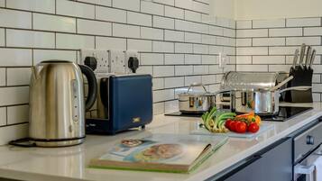 Oven, dishwasher, high chair, cookware/dishes/utensils