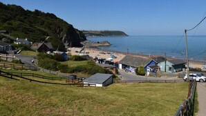 A coastal village with houses, a beach, and a clear view of the sea. - 2 Bed in Cardigan (oc-89315) (Tresaith)