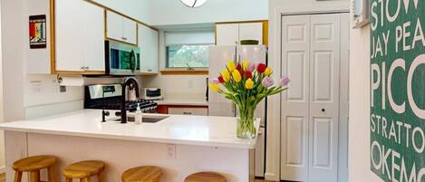 Coffee/tea maker, fridge, microwave, oven