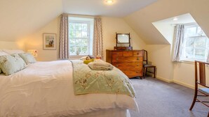 A bedroom with a bed, dresser, and a window with curtains. - 4 Bed in Ayr- (oc-90038) (Ayr)
