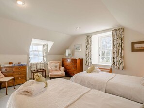 A bedroom with two beds, a dresser, a chair, and a desk. - 4 Bed in Ayr- (oc-90038) (Ayr)