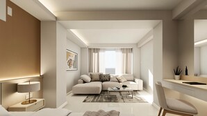 Una sala de estar moderna con sofá, mesa de centro y zona de escritorio.