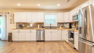 Coffee/tea maker, fridge, microwave, oven