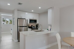 Coffee/tea maker, fridge, microwave, oven - Chic Canalside Condo, Steps from Beach & Pool (Sanibel)