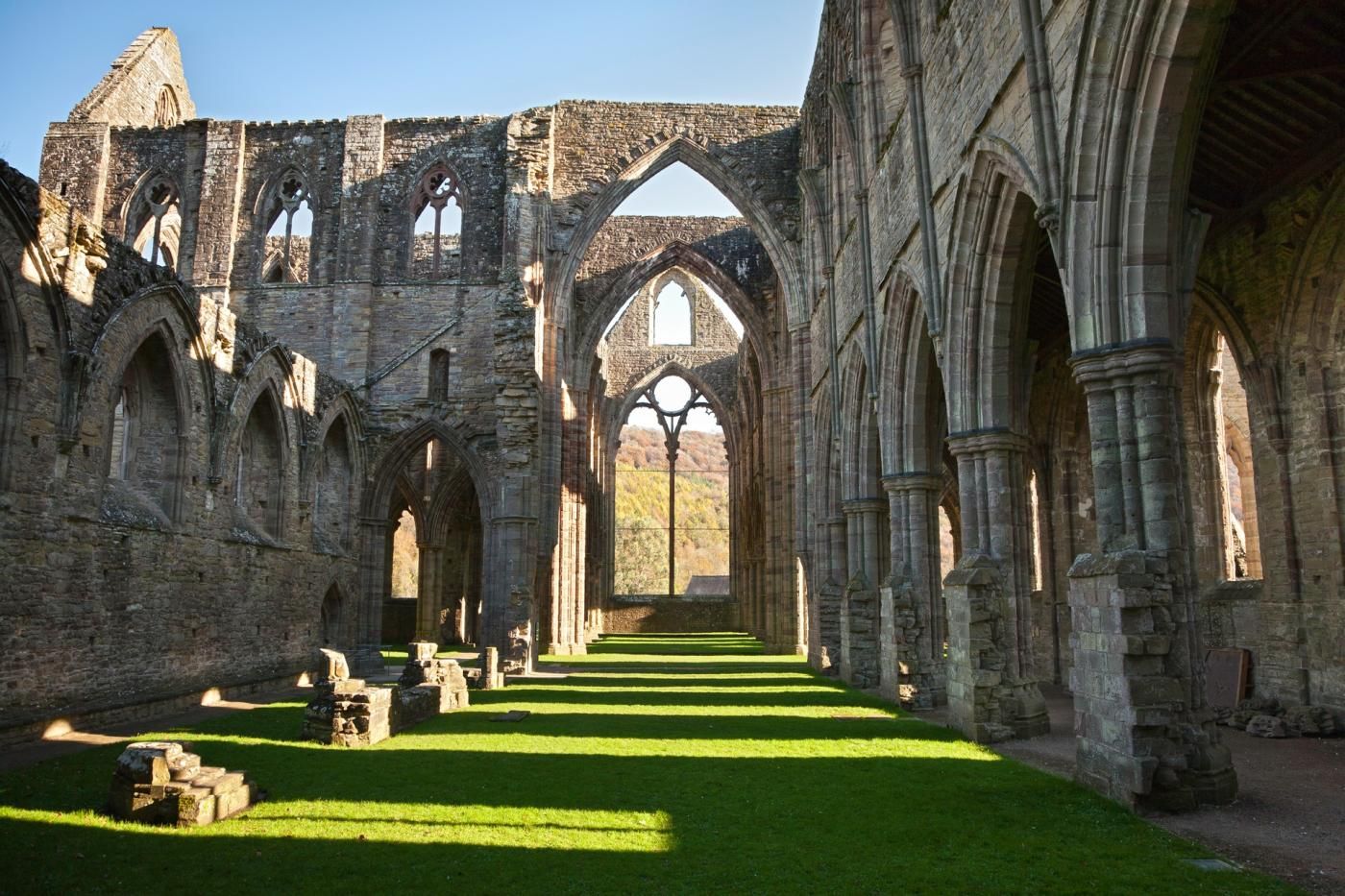 An interior of a historic building with arched ceilings and stone walls.