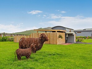 A fenced area with a building that has a curved roof and a small attached structure. - 1 Bed in Rhayader (oc-90284) (Saint Harmon)