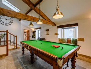 A pool table in a room with wooden beams, a clock, and a staircase. - 5 Bed in Lancaster (oc-90546) (Bentham)