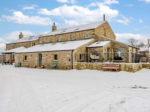 A stone building with a large porch and a snow-covered roof. - 5 Bed in Lancaster (oc-90546) (Bentham)