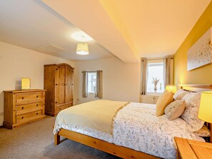 A bedroom with a large bed, wooden wardrobe, and a window with curtains. - 2 Bed in Bonnybridge (oc-90602) (Bonnybridge)