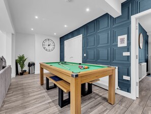 A pool table in a room with a clock on the wall and a door with a sign. - Family lux home/6-car drv/ pool table/projector/ (Chadderton)