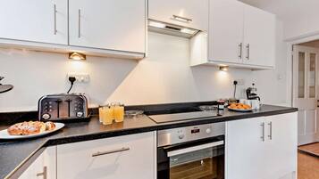 Oven, dishwasher, high chair, cookware/dishes/utensils