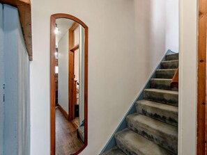 A staircase with carpeted steps and a wooden handrail, leading to an upper floor. - 2 Bed in Alnwick (oc-91486) (Boulmer)
