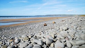 A pebble beach with a clear sky. - 6 Bed in Bideford (oc-91693) (Westward Ho!)