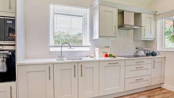 Oven, dishwasher, high chair, cookware/dishes/utensils