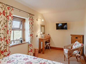 A bedroom with a bed, a desk, a chair, a television, and a window with curtains. - 1 Bed in York (oc-92093) (High Catton)