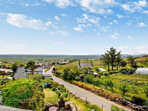 A rural village with houses, a road, and a clear sky. - 2 Bed in Pwllheli (oc-92561) (Llithfaen)