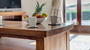A wooden table with two white cups and a bowl of fruit. - 3 Bed in Wigton (oc-92500) (Uldale)