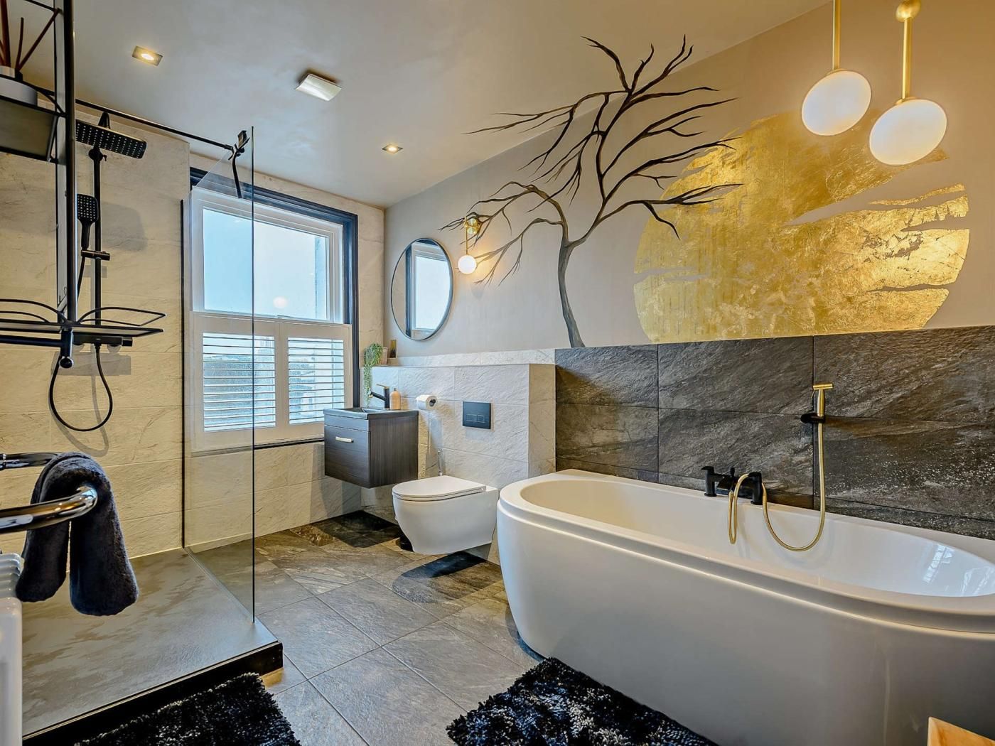 A modern bathroom with a freestanding bathtub, a glass shower enclosure, and a large window providing natural light.