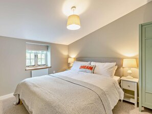 A bedroom with a bed, bedside lamps, a window, and a door. - 2 Bed in Barnstaple (oc-93023) (Chapelton)