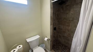 Shower, towels, soap, toilet paper