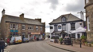 A street with buildings, a Cobble Corner shop, and a Korev tent. - 1 Bed in Marazion (oc-53251) (Marazion)