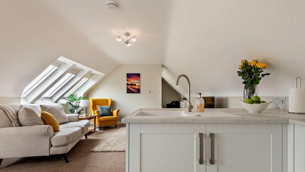 A modern loft apartment with a kitchen, living area, and a skylight. - 1 Bed in Blandford Forum (oc-93922) (Spetisbury)