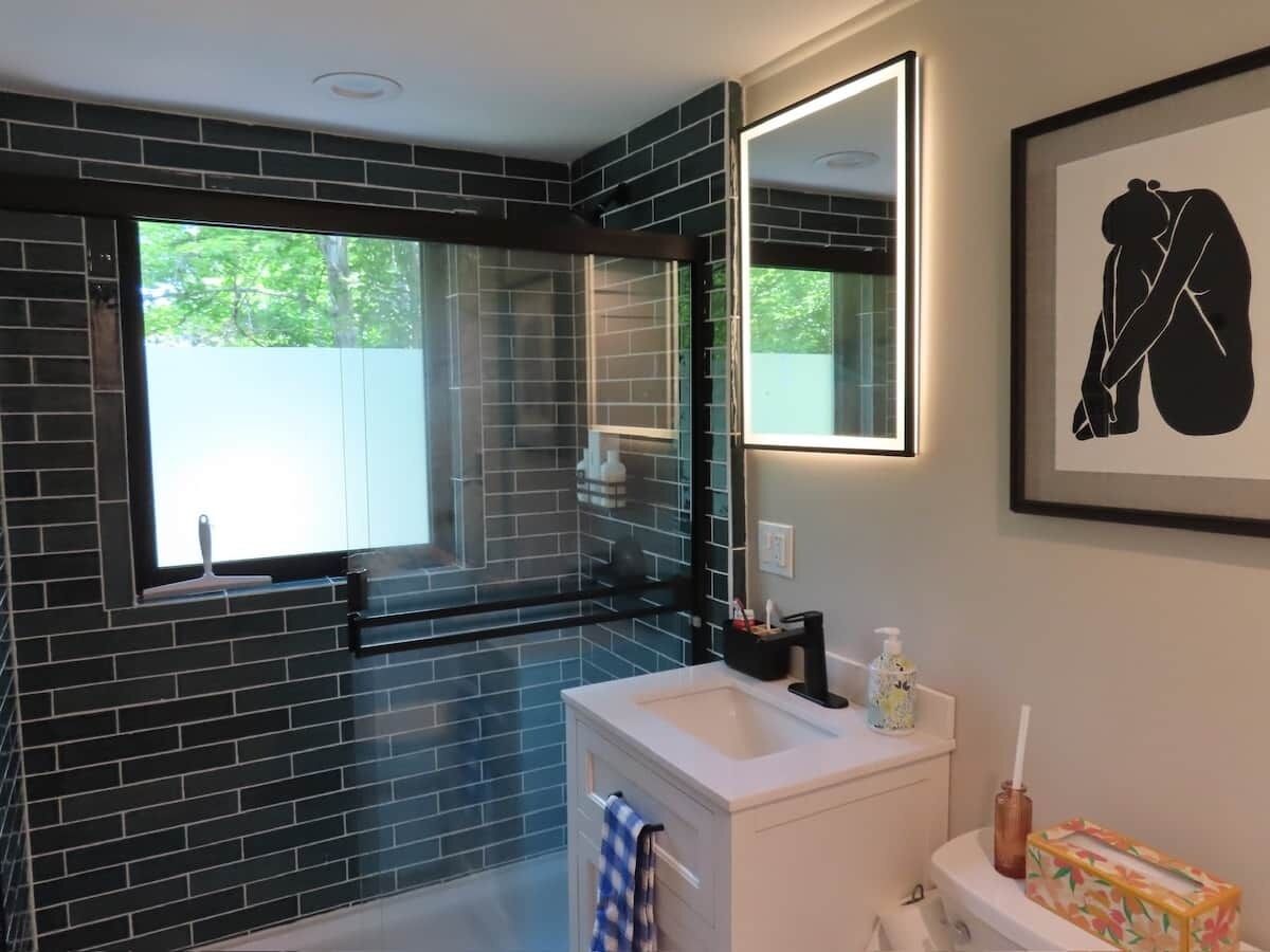 Shower, hair dryer, soap, toilet paper