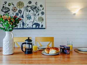 A breakfast table with a coffee pot, a glass of orange juice, croissants, and a jar of jam. - 4 Bed in Shrewsbury (oc-93398) (Sheinton)