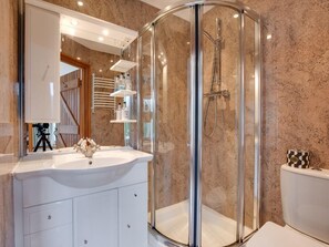 A modern bathroom with a glass-enclosed shower, a white vanity with a sink, and a large mirror. - 3 Bed in Buxton (oc-94110) (Cressbrook)