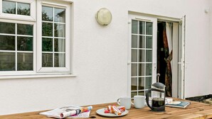 A wooden table with a newspaper, a plate of food, a coffee pot, and cups. - 3 Bed in Market Rasen (oc-93253) (Ranby)