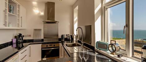 Oven, dishwasher, highchair, cookware/dishes/utensils