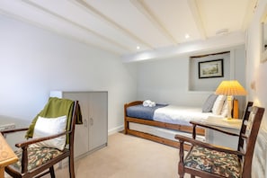 A bedroom with a single bed, a wooden chair, a desk, and a wardrobe. - 5 Bed in Matlock (oc-93585) (Brassington)