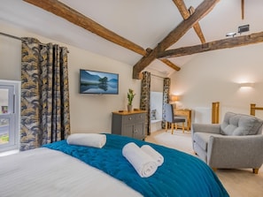 A bedroom with a bed, a desk, a chair, and a television. - 1 Bed in Grange-over-sands (oc-78659) (Cartmel)