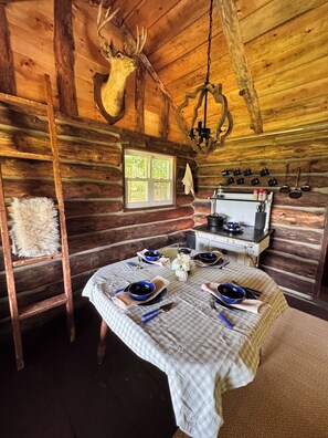 Dining - Marvelous Off-Grid Log Cabin Getaway on Working Horse Ranch. (Johnsonville)