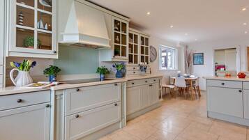 Oven, dishwasher, high chair, cookware/dishes/utensils