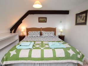 A bedroom with a bed, two bedside lamps, a picture on the wall, and a staircase. - 2 Bed in Biggar (oc-ca366) (Biggar)