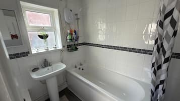 Shower, hair dryer, towels, shampoo