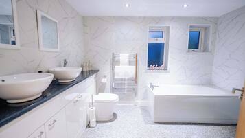 Shower, hair dryer, towels, shampoo