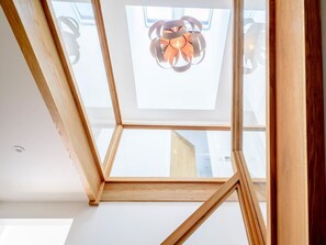 A skylight with a modern light fixture. - 4 Bed in Bude (oc-66706) (Bude)