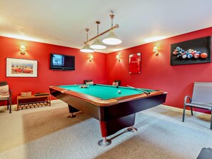 A pool table in a room with red walls, a television, and a framed picture. - 2 Bed in Gloucester (oc-94228) (Frampton on Severn)