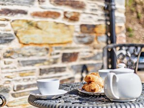 A table with a teapot, two cups, and croissants. - 1 Bed in Launceston (oc-86675) (South Petherwin)