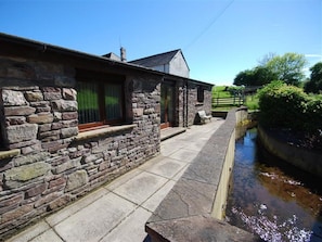 A stone building with a narrow water channel beside it. - 2 Bed in Cradoc (BN103) (Cradoc)