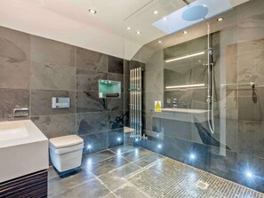 A modern bathroom with a shower, toilet, and sink. - 3 Bed in Underskiddaw (oc-sz377) (Underskiddaw)