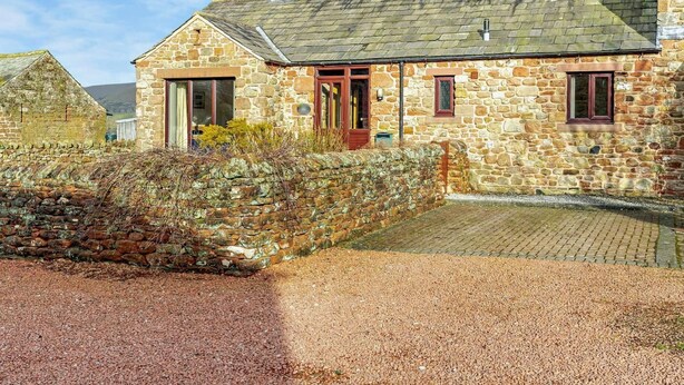 A stone house with a sloped roof, a chimney, and a small porch. - 2 Bed in Appleby-in-westmorland (oc-91029) (Dufton)